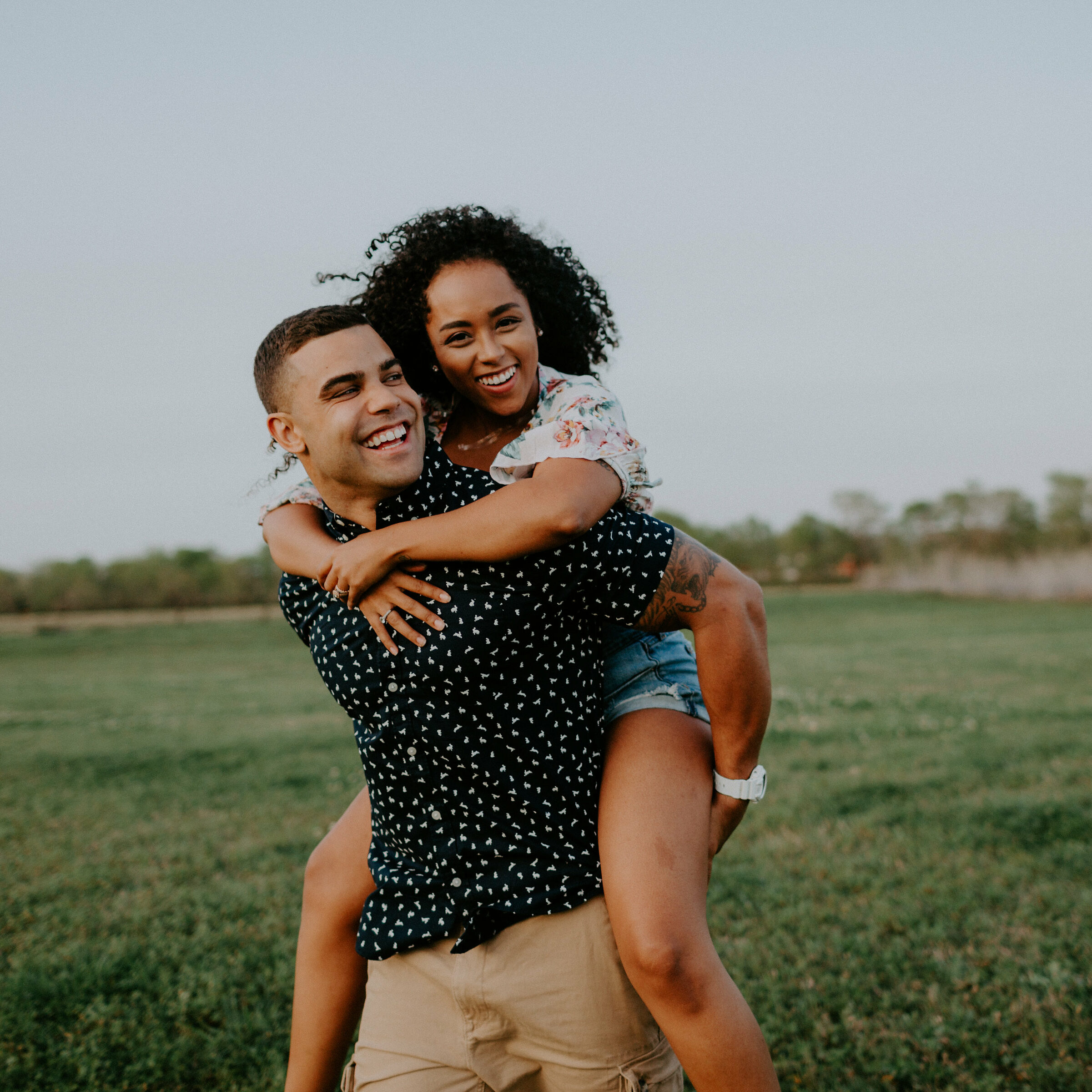 woman getting piggyback ride from a man
